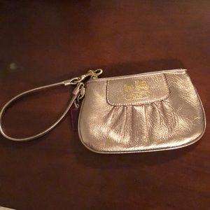 Rose gold coach wristlet